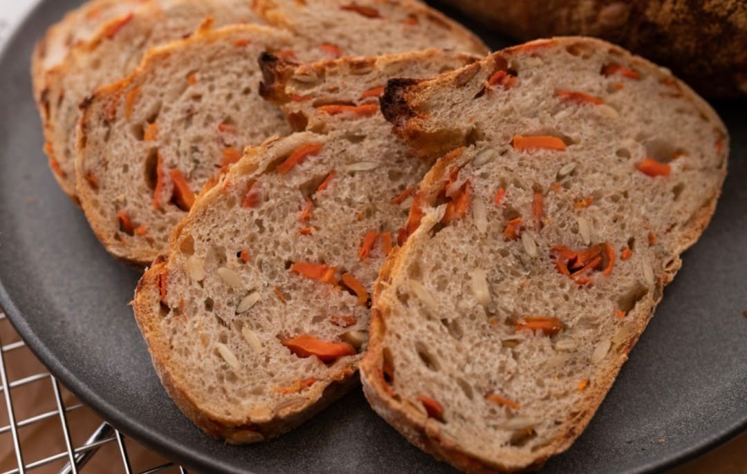 Our Carrot and Pumpkin Seed bread is fast becoming one of your favourites so we're keeping it going until the end of November! This 40-hour long fermentation bread has a satisfying, chewy crust and a moist interior. It’s filled with freshly sliced local carrots from Riverbend Gardens and organic pumpkin seeds for an added crunch.
This bread is a healthy choice because the natural leavening process pre-digests the sugars, lowering the glycemic index of the loaf so it won’t spike your blood sugar.
Available Fridays & Saturdays until November 29.