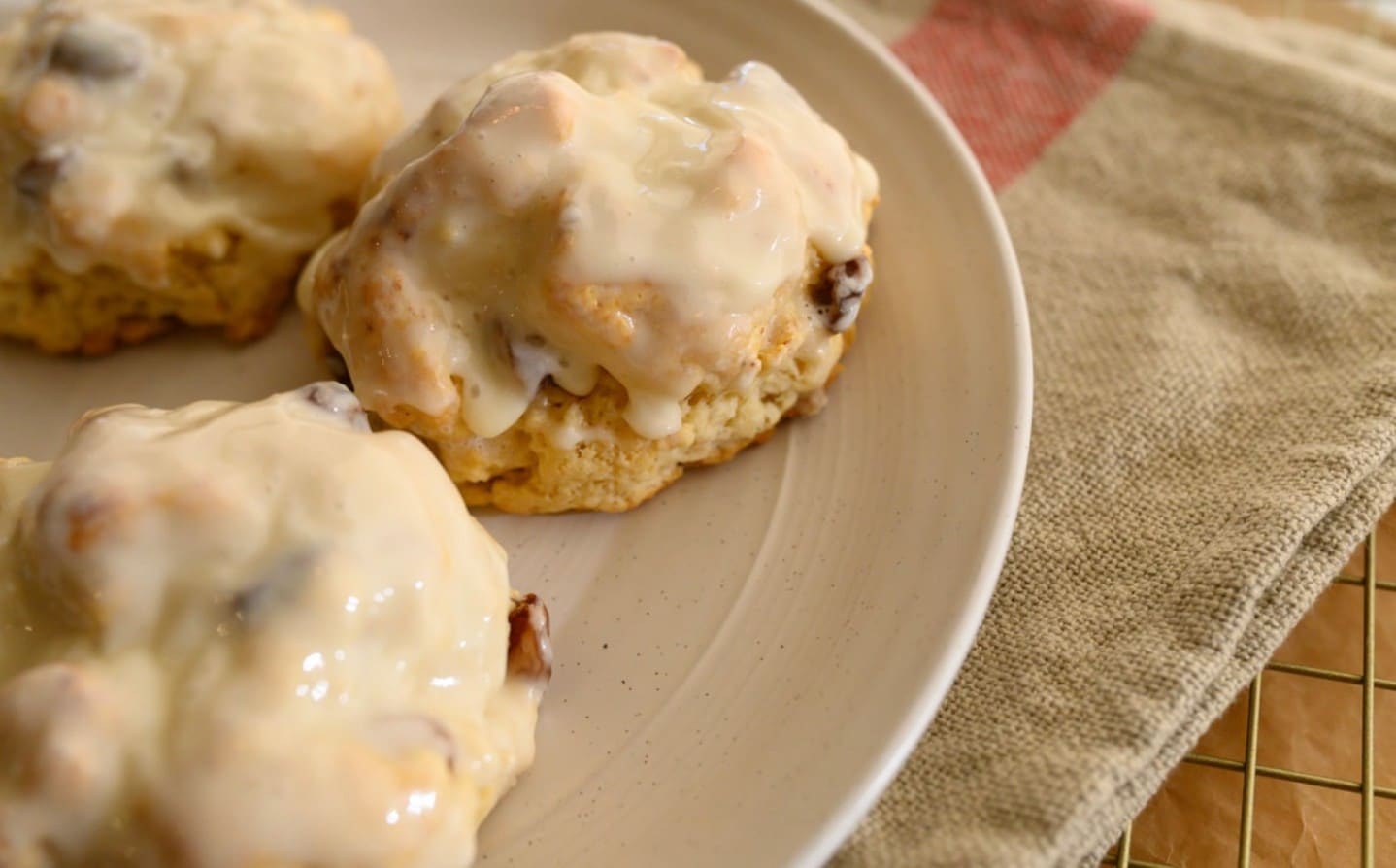 Christmas morning is calling, and it wants an eggnog raisin scone. Our crumbly scone gets an infusion of eggnog cream and a sweet eggnog glaze. We’ve also added Appleton Estate Rum-soaked raisins for good measure!